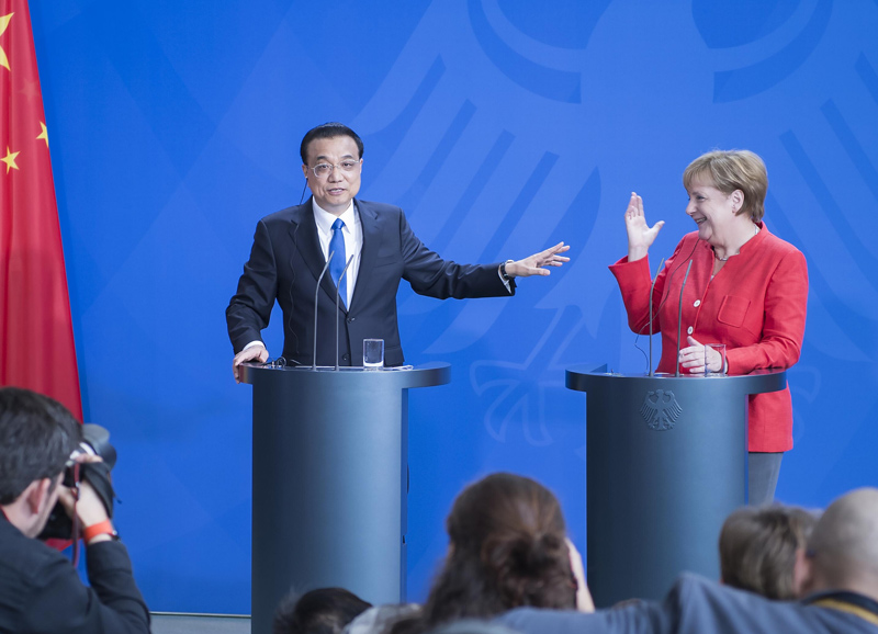 中德总理携手力挺自由贸易，国际媒体高度关注